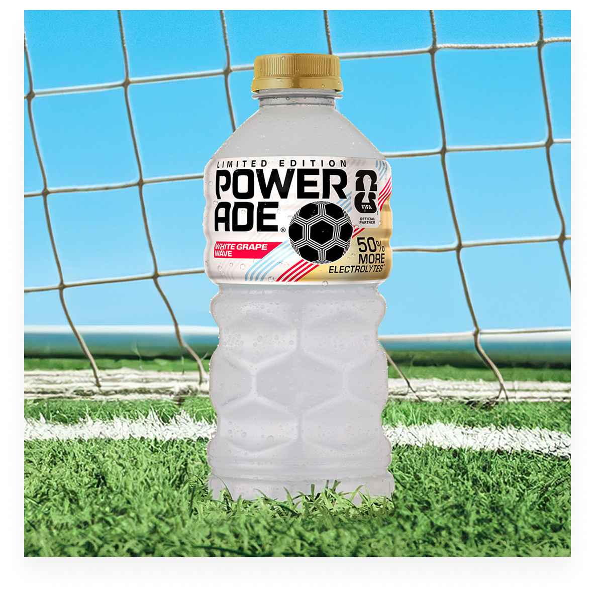 A bottle of Powerade Legacy White Grape Wave on a soccer field