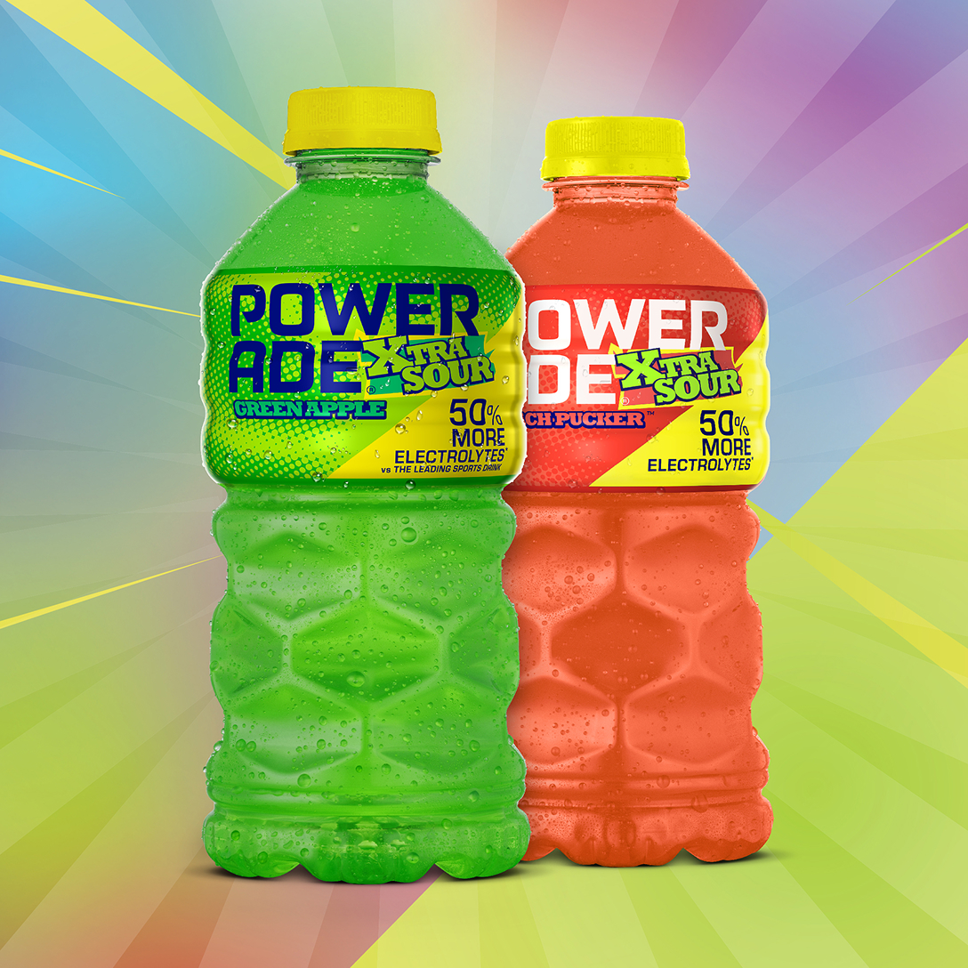 powerade xtra sour bottles on multi-colored background